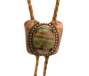 This Bolo Has a Classic Copper Tone Cowboy Slide with Striped Jasper and Copper Metallic Cord with Copper Tone Tips